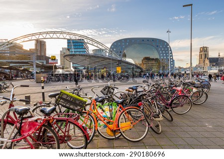 ROTTERDAM, THE NETHERLANDS - DECEMBER 5, 2014: Sunset view of the Rotterdam\'s Blaak train station with the new Market Hall behind.