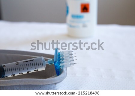 a typical syringe for mesotherapy with five micro-needles ready for use