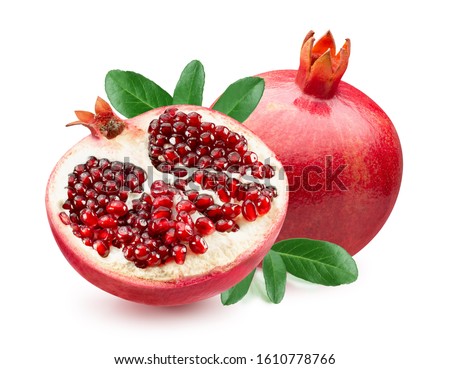 pomegranate with half of pomegranate and leaves isolated on a white background