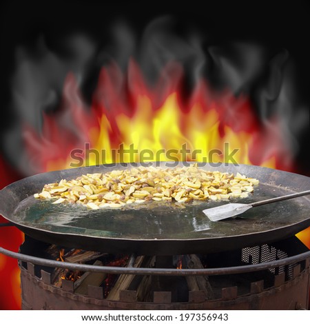 potatoes on the grill in flames