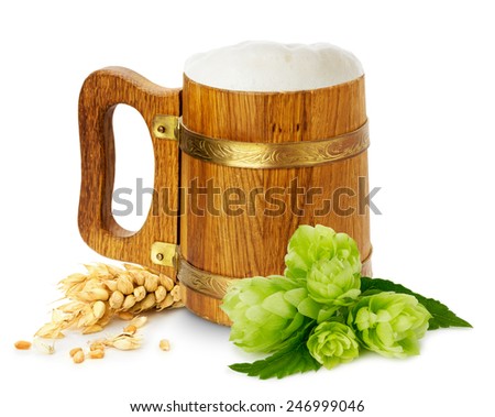 wooden mug with beer, green hops and wheat
