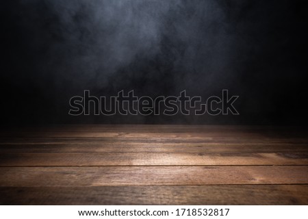 empty wooden table with smoke float up on dark background Stok fotoğraf © 
