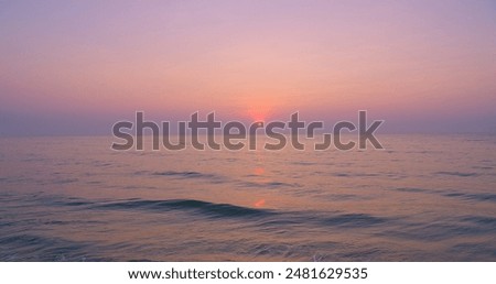 Similar – Image, Stock Photo Scenic sunset over peaceful sea and hilly shores