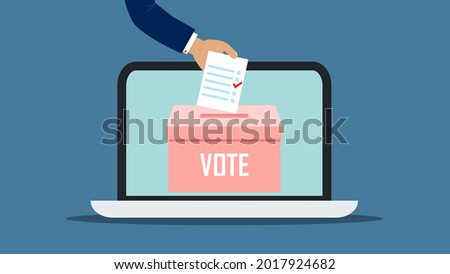 Human hand puts vote bulletin into vote box on the laptop screen, online voting. Vote bulletin, vote box, ballot box, elections, voting, online voting concepts. Blue background.