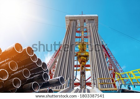 Oil and Gas Drilling Rig. Oil drilling rig operation on the oil platform in oil and gas industry. Top drive system of drilling rig