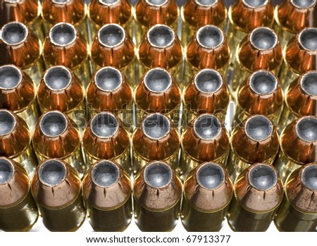 Cartridges with copper plated bullets with lighting from underneath and behind