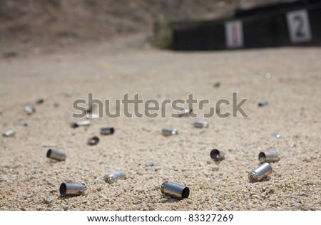 Dozens of empty ammo shells on the firing line of a range