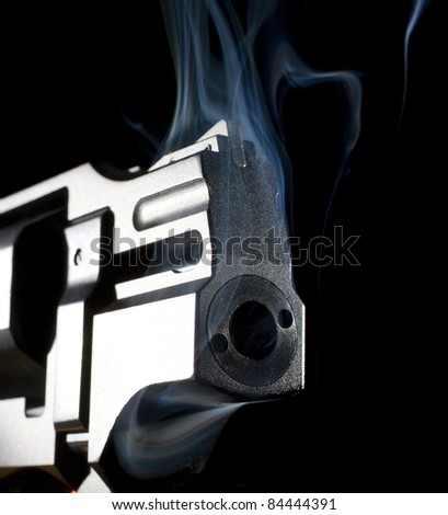 revolver that has been shot and is smoking hot