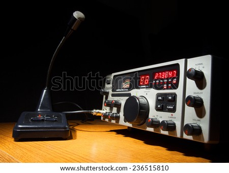Two way radio and microphone that are on desk