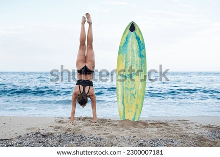 Similar – Image, Stock Photo Unrecognizable athlete practicing surfing on ocean wave