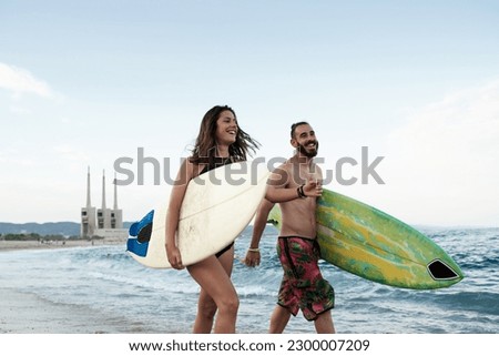 Similar – Image, Stock Photo Content female surfer walking on beach with surfboard