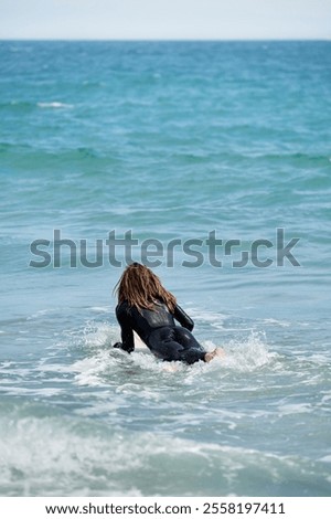 Similar – Image, Stock Photo Unrecognizable man on wet beach