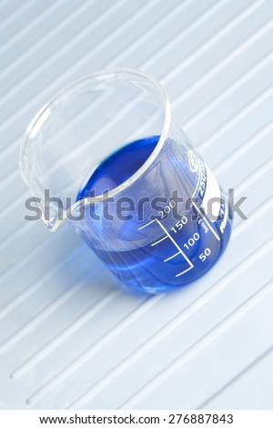 250ml measuring beaker filled with blue liquid