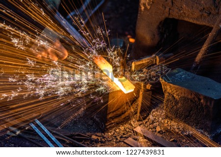 Similar – Image, Stock Photo Blacksmith hands forging molten metal on anvil