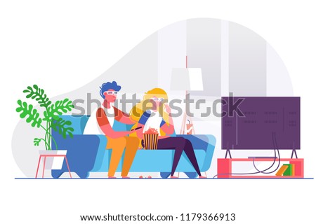 Couple watching 3d movie on big TV.