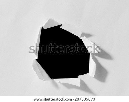 Black hole in white paper.