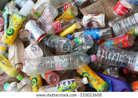Roi Et, THAILAND - AUGUST 1, 2015: plastic bottles and beverage cans on a recycle factory in Roi Et, Thailand. The plastic can will be sorted for recycling.
