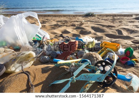 Similar – Foto Bild Am Strand gesammelte Plastikpfropfen.