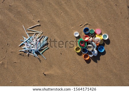 Similar – Foto Bild Am Strand gesammelte Plastikpfropfen.