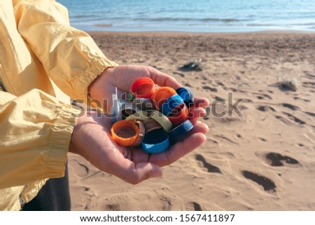 Similar – Foto Bild Am Strand gesammelte Plastikpfropfen.