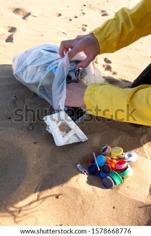 Similar – Foto Bild Am Strand gesammelte Plastikpfropfen.