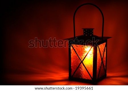 Burning lantern in the dark