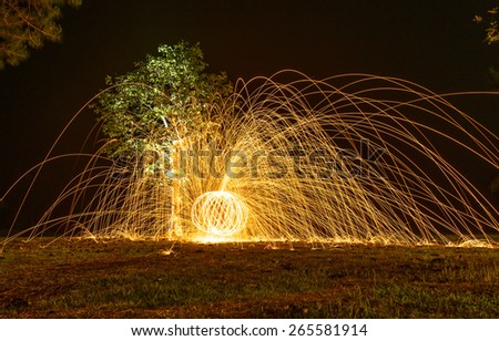 spinning fire ball by burning steel wool - fire twirl