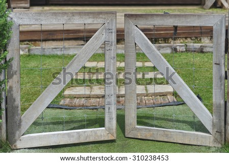 wooden fence and gate open to farm