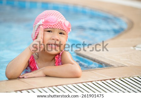 Little cute Asian girl on bikini suit