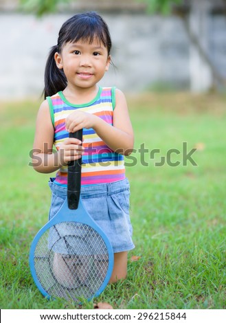 Cute asian holds electronic mosquito trap on nature background
