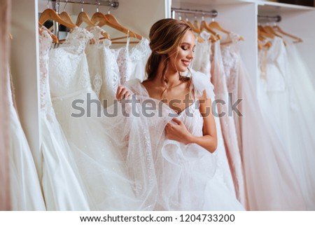 Similar – Image, Stock Photo bride trying on white wedding dress