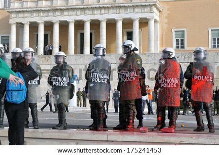 ATHENS, GREECE-DEC. 12. Riot police covered in red paint. , during demonstration against austerity measures, in front of Greek parliament, in Athens, December 22, 2008.