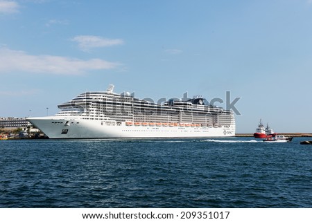 Piraeus, Greece - July, 24, 2014: Msc Fantasia is a cruise ship of Msc Cruises. Has built in 2008,Tonnage 137,936 GT, Length 333.3 m, Passengers 3,900 and Crew 1,313