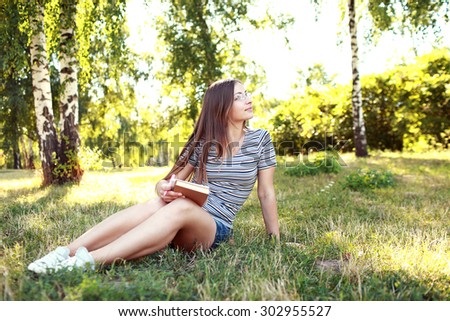 Young girl studying in the park