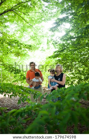 Grandparents and their grandchildren having fun in the nature.