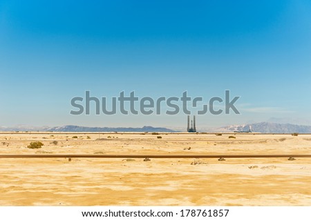 oil pipeline and oil rig in the Sahara desert, Egypt.