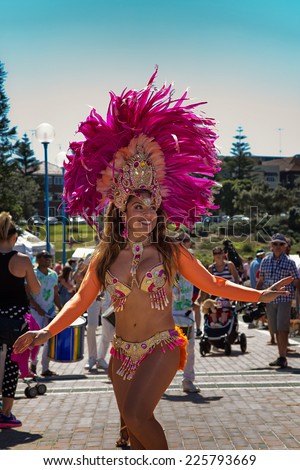 COOGEE,AUSTRALIA - SEPTEMBER 28,2014: Brazilian dancers and drummers provide entertainment at a beach soccer tournament between police and international students.
