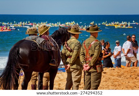 COLLAROY,AUSTRALIA - APRIL 25,2015: Soldiers and surf lifesavers commemorate the centenary of the ANZAC landings at Gallipoli. Several local surf lifesavers died in the campaign.