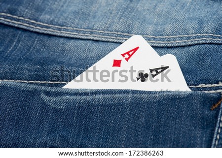 pair of aces in a jeans pocket