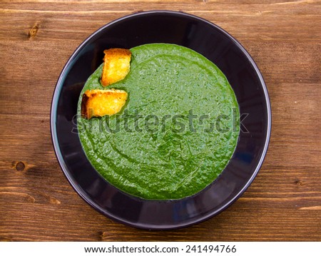 Creamed spinach with toasted wooden table top view