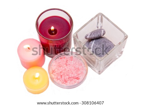 Candles and bath salts on white background seen from above