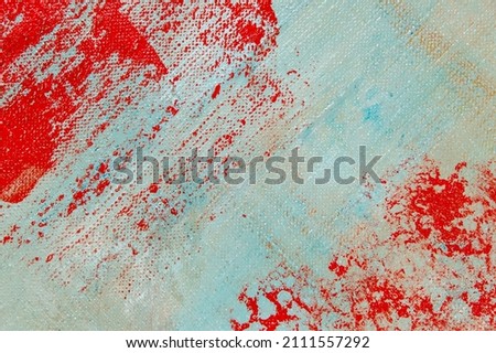 abstract creative background: red blurred stains of colored primer when toning the canvas, temporary object. 