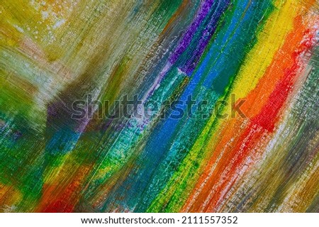 abstract rainbow multicolored background formed by erasing paints from the canvas, short focus. Not an art object, temporary effect. 