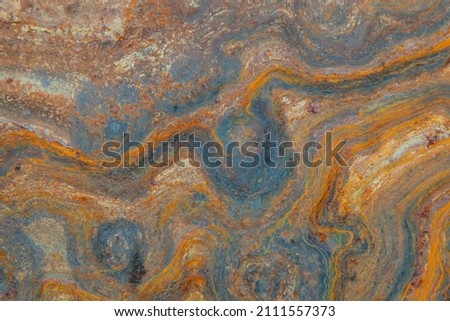 grunge background: curly rust on an old metal surface, toning 