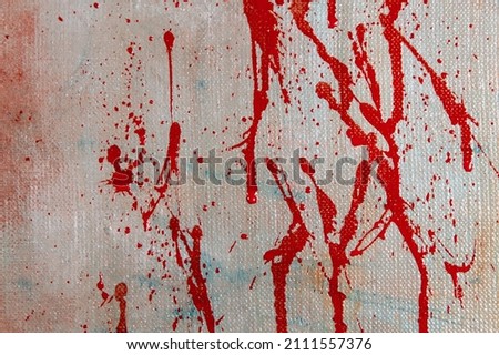 abstract creative background: red blurred spots and splashes with stains of colored primer when toning the canvas, a temporary object. 