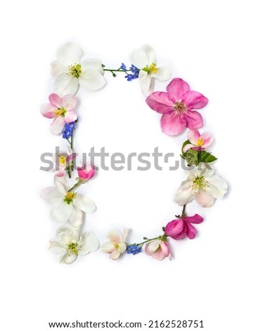 Letter D of flowers apple tree and blue wildflowers forget-me-nots on white background. Top view, flat lay Stok fotoğraf © 