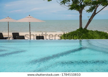 Luxury swimming pool and blue water at the resort with beautiful sea view, Hua Hin Cha Am Thailand. Photo stock © 