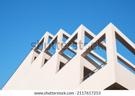 Similar – Image, Stock Photo Geometric facade of a minimalist building under the last afternoon lights