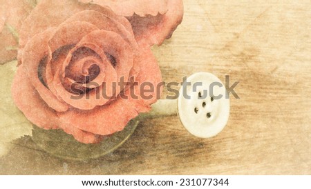 rose bouquet flowers in watering can with vintage grunge background