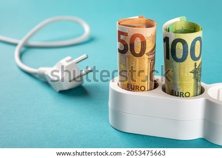 Similar – Image, Stock Photo Socket and euro bills placed in the shape of a circle. Concept of saving electricity at home. Euro banknotes. Electricity costs and expensive energy concept